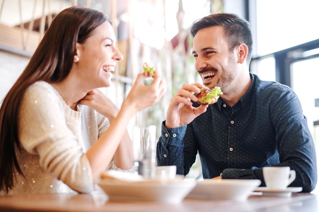 Web_Desktop-Beautiful young couple sitting in a cafe, having breakfast. Love, food, lifestyle