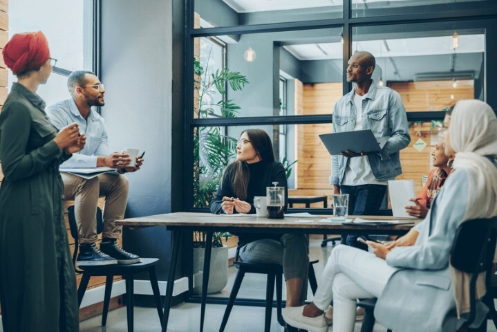 Multicultural business professionals having a meeting in an office (Small)